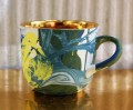 Grafika mug multicolor full gold.jpg